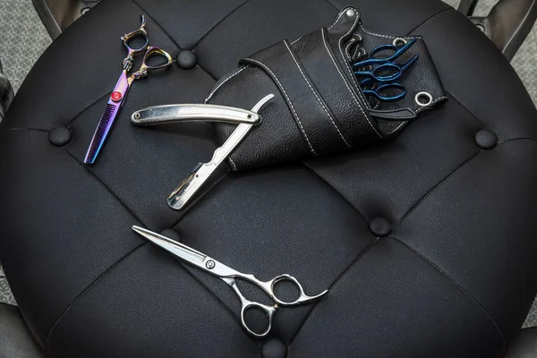 Scissors, hair removers, barber razors and a case for all of them