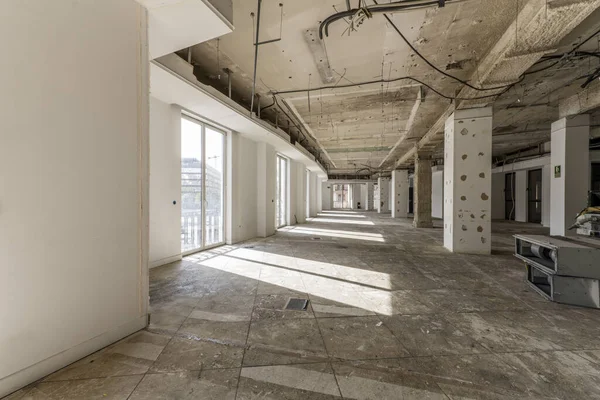 stock image An office space under construction with many windows with balconies in the absence of new roofs and floors and air conditioning units