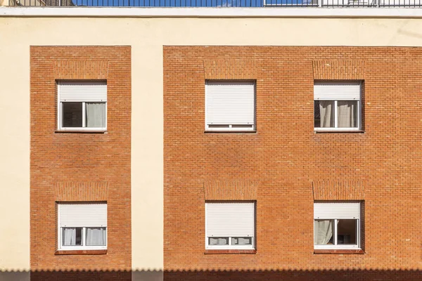 Square windows on the facade of a residential building