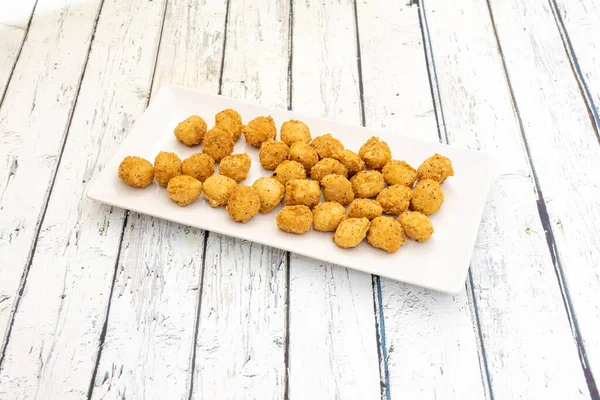 Popcorn chicken is a dish consisting of small bite-sized pieces of chicken that have been breaded and deep-fried