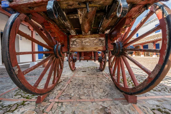 stock image A vintage wooden cart for working in the fields painted red