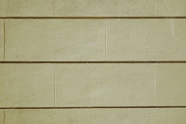 Soluk sarı renkli tuğla beton bir duvarın yüzeyi. Vektör çimento dokusu arkaplanı