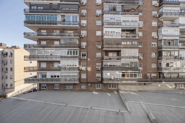 stock image Interior facade of urban residential buildings with a courtyard covered with a gray roof