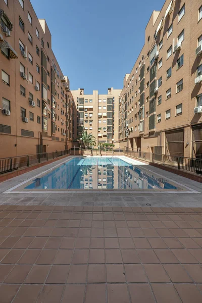 Pool of a community of neighbors in the common areas of a closed urbanization with clay floors