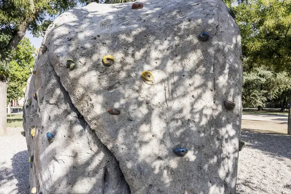 In many climbing gyms, artificial holds are organized in a path called a route or a route