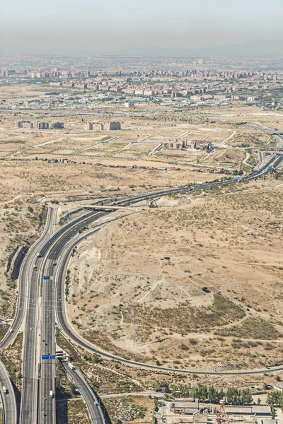 Aerial image of an access highway to a city with air pollution