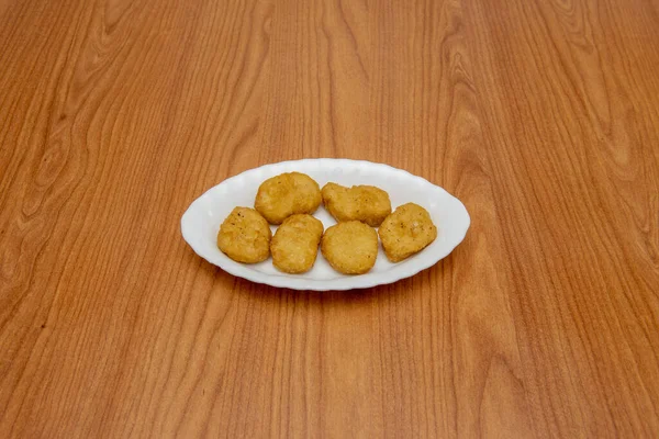 Chicken nuggets are generally considered a greasy and unhealthy food
