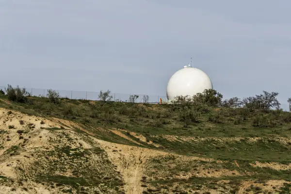 Hilltop with a geodesic dome protecting an aeronautical radar