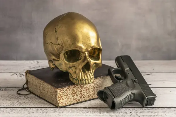 A golden skull armed in case you don\'t like the novel