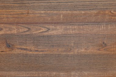 Doğal buğday, görünür düğümler ve sıcak kehribar tonları ile sıkıntılı ahşap tahta, organik arka planlar ve zanaat projeleri için mükemmel