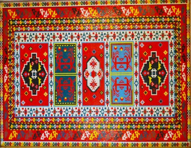 Halı dokusu, soyut süs. Geleneksel süslemeli renkli Doğu Mozaik Halı. Desenli halı. El yapımı örgü halısının yakın görüntüsü.