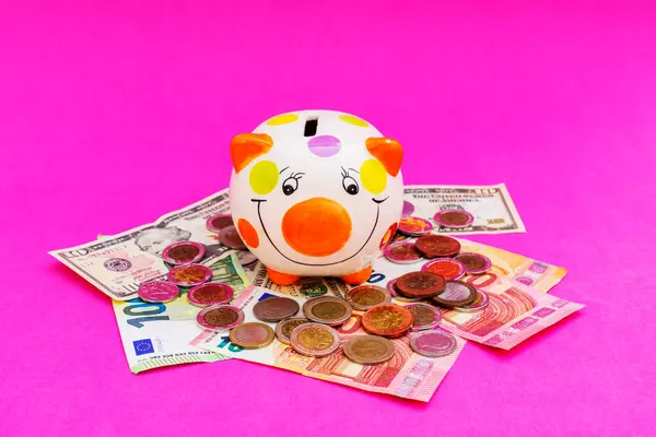 Piggybank and money tower , to save , saving money for affordable things, financial concept .Piggybank or deposit box on a wood background, depict saving money to make a trust fund for children, teach them for saving habit