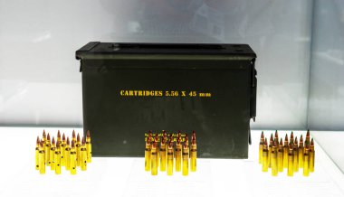 Cartridges and bullets of various calibers and sizes for pistols, submachine guns, machine guns and shotguns on display at the exhibition. clipart