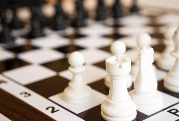 Chess pawns on the chessboard. Closeup