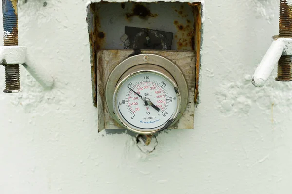 Close-up of a temperature gauge on a chemical tanker