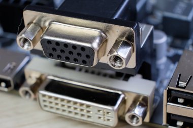 Close-up of computer VGA and DVI ports with electronic circuit boards