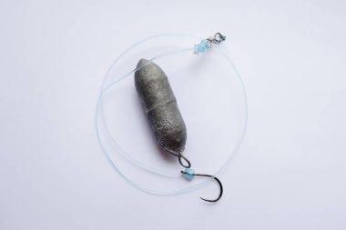 Sinker with fishing rod and string on white background