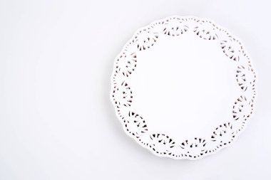 Stack of white frilly paper napkins. Macro shots