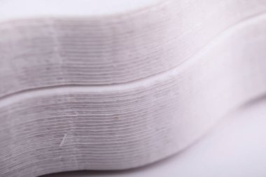 Selective focus Stack of white paper napkins. Macro shot