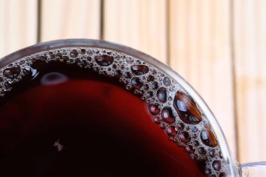 Macro shot of tea bubbles on glass surface