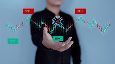Finansal veri alım satım grafiğini analiz eden bir işadamı. İş finans teknolojisi ve yatırım konsepti. Borsa yatırım fonları ve dijital varlıklar