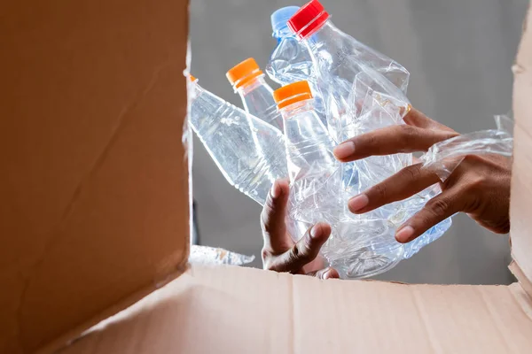 Man Collects Puts Recyclable Plastic Bottles Cardboard Box — Stock Photo, Image