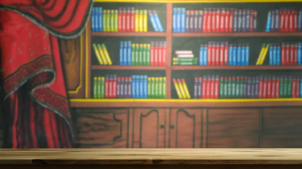 Empty wooden table with blurred bookshelf background in library. The empty space can be used for montage or product and advertising display designs