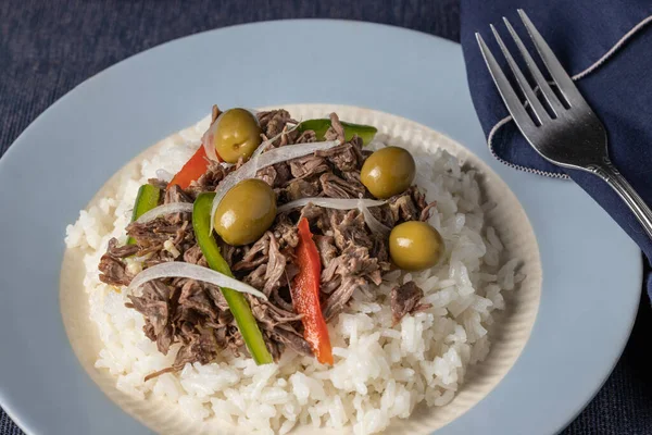 Close up of shredded meat with rice, typical Cuban food.