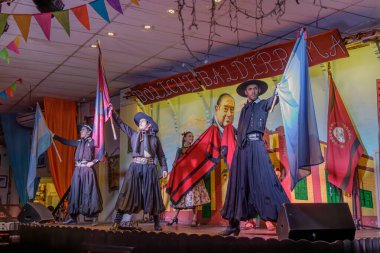San Miguel de Tucuman, Argentina - January 24th, 2024: Argentine folklore dancers at the Boliche Balderrama in the city of Salta. clipart