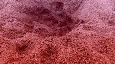 Background of the red color of the texture and pattern of the sand floor.