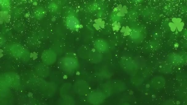 抽象的なスムーズな動き グリーン光沢のある輝くハッピー セント パトリックス デイのお祝いのためのシャムロッククローバー グリッターとほこりの輝く背景 シームレスループアニメーション 高品質の4K映像 — ストック動画