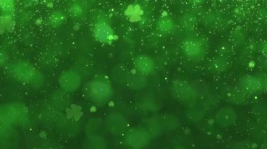 Aziz Patrick Günü için yeşil soyut bokeh efekti yonca yonca yoncası video animasyonu ile hareket döngüsü tasarımı. Yüksek kalite 4k görüntü
