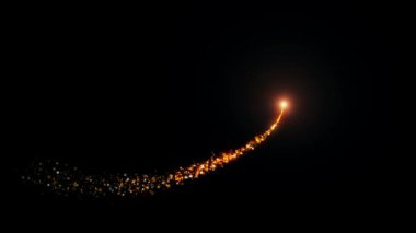 Siyah arka planda parlayan güzel sihirli parçacık izi animasyonu.