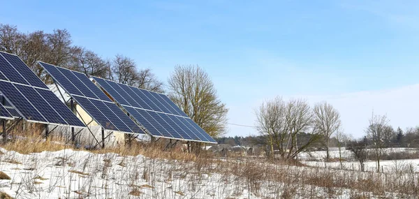 Solar cells Photoelectric cells on a bright, sunny, frosty winter day in the countryside. Solar batteries are an alternative energy.