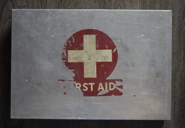 vintage steel aluminum box with red FIRST AID symbol