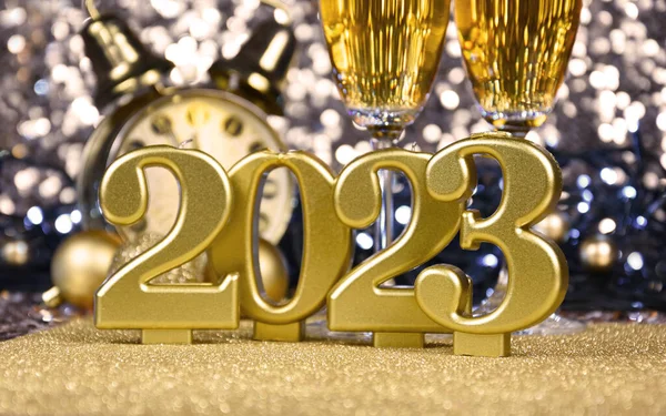 New Year 2023 golden candles still life stock photo images. New Year\'s Eve party 2023 golden shiny background stock images. Gold decoration for the year 2023 stock photo