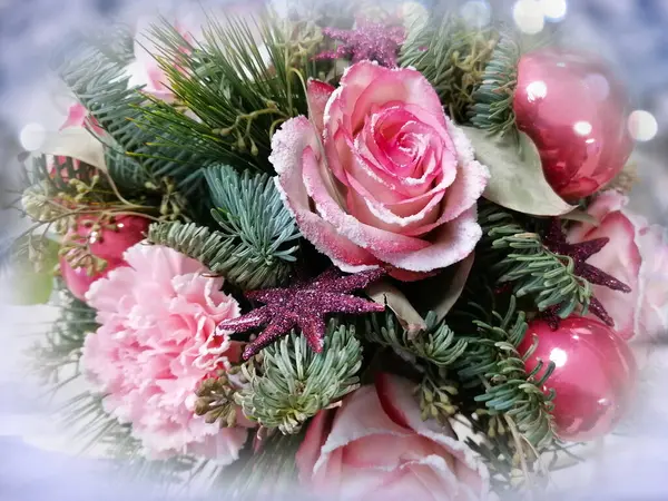 Christmas bouquet with pink roses and ornaments close-up stock photo images. Luxury floral christmas decoration stock photo. Beautiful Christmas bouquet with pink roses, ornaments and green spruce branches