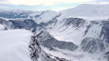 Aerial view of beautiful snowy mountains in Gudauri, Georgia