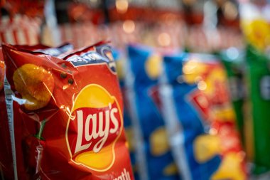 Potato chips on the shelves at the supermarket. Ankara, Turkey - July 20, 2023.