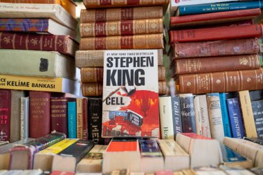 Cell book by Stephen King at the flea market. Ankara, Turkey - August 6, 2023. clipart