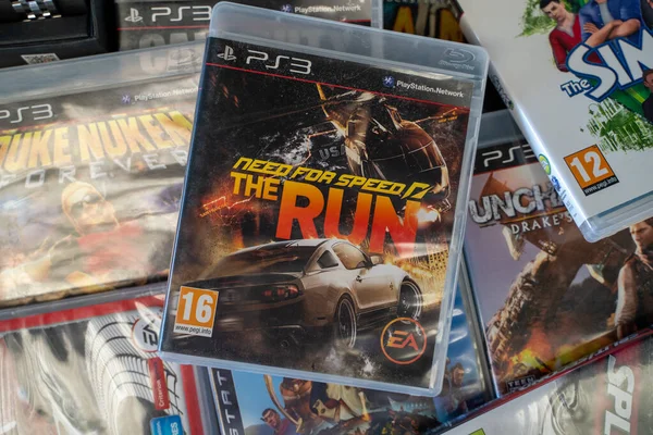 stock image Need for Speed The Run PlayStation game CD at the flea market. Ankara, Turkey - August 6, 2023.