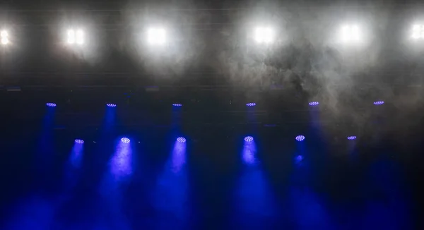 White and blue stage lights in the fog.