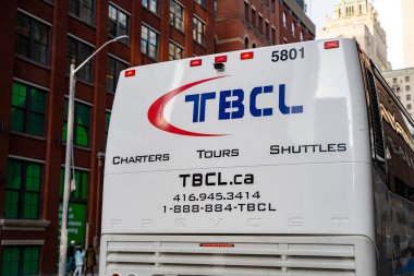 Toronto Bus Company Ltd. (TBCL) bus in Toronto Downtown. Toronto, Canada - April 29, 2024. clipart