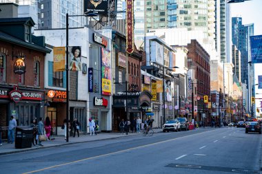 View of Yonge Street. Yonge Street is a major arterial route in the Canadian province of Ontario. Toronto, Canada - April 30, 2024. clipart