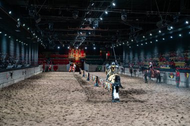 Medieval Times Dinner and Tournament is a family dinner theater featuring staged medieval-style games, sword-fighting, and jousting. Toronto, Canada - April 30, 2024. clipart