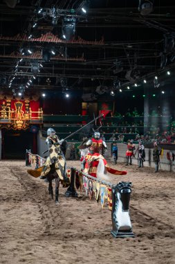 Medieval Times Dinner and Tournament is a family dinner theater featuring staged medieval-style games, sword-fighting, and jousting. Toronto, Canada - April 30, 2024. clipart