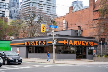 Harvey's restaurant on Jarvis Street. Harvey's is a fast food restaurant chain operating in Canada. Toronto, Canada - May 12, 2024. clipart