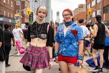 The couple at the Pride Weekend Festival on Church Street. Toronto, Canada - Jun 29, 2024. clipart