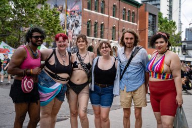 People attending the Pride Weekend Festival on Church Street. Toronto, Canada - Jun 29, 2024. clipart