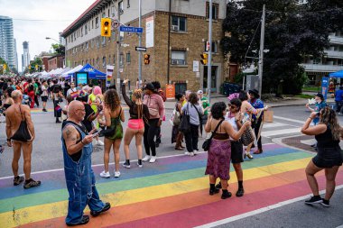 Crowds of people at the Pride Weekend Festival on Church Street. Toronto, Canada - Jun 29, 2024. clipart